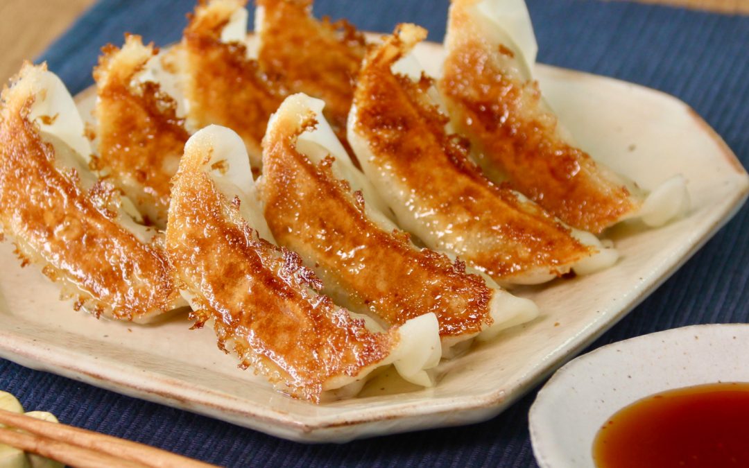 Pan-fried gyoza served with Momiji Oroshi Ponzu dipping sauce