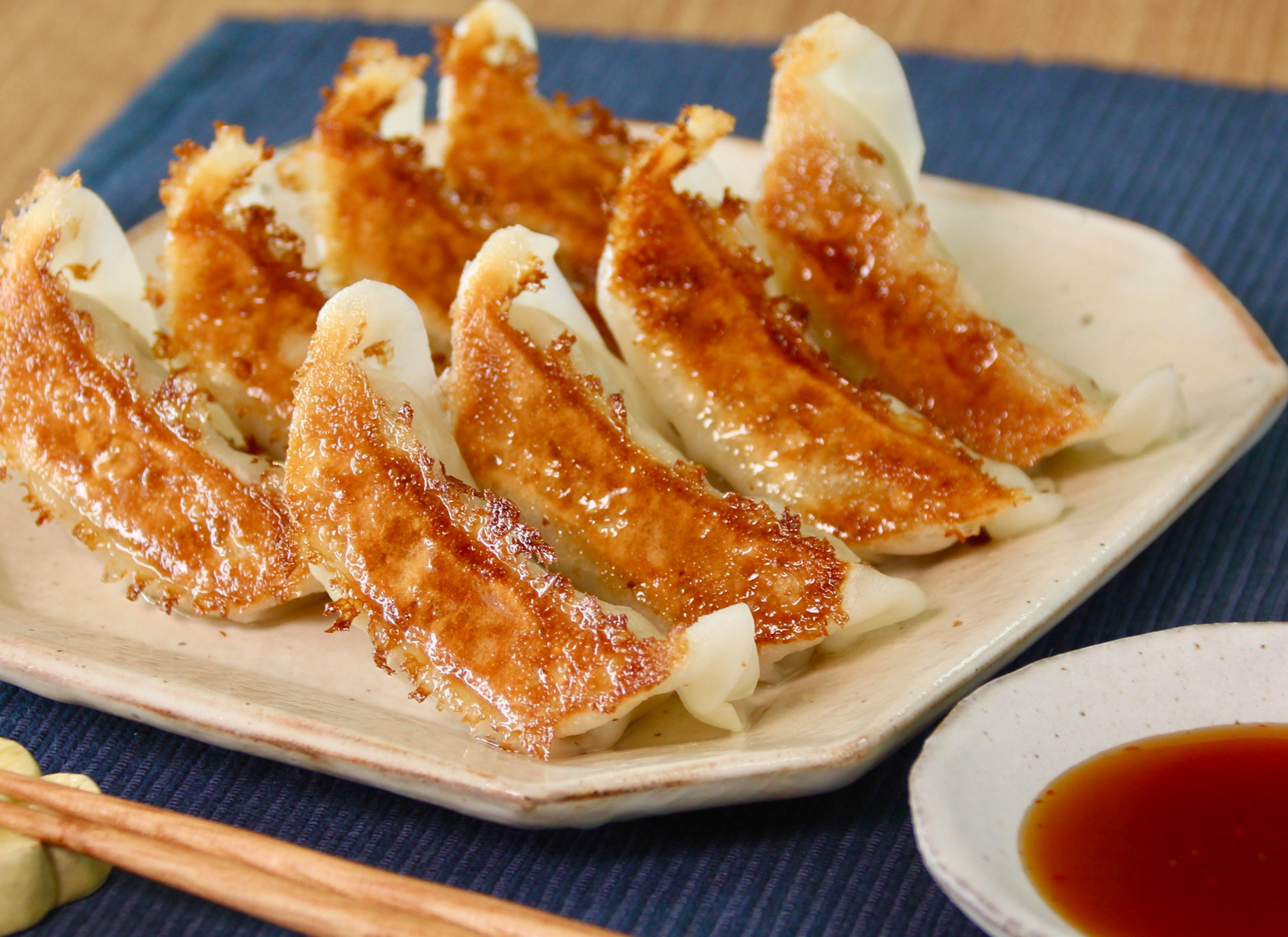 Pan-fried gyoza served with Momiji Oroshi Ponzu dipping sauce